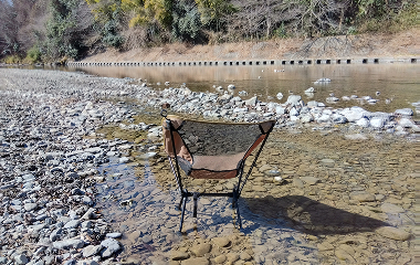 The outdoor chair set up in the shallows of the Akigawa River.